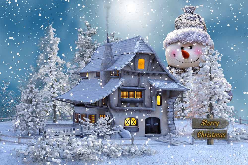 Vánoční pohlednice ke stažení zdarma s obřím sněhulákem a zasněženým domem