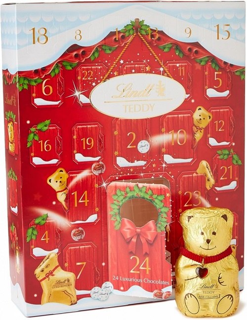 Červený adventní kalendář Lindt se zlatým medvídkem a zajíčkem.